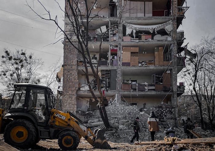 A destroyed building in Kyiv, Ukraine, showing urban devastation and reconstruction efforts.